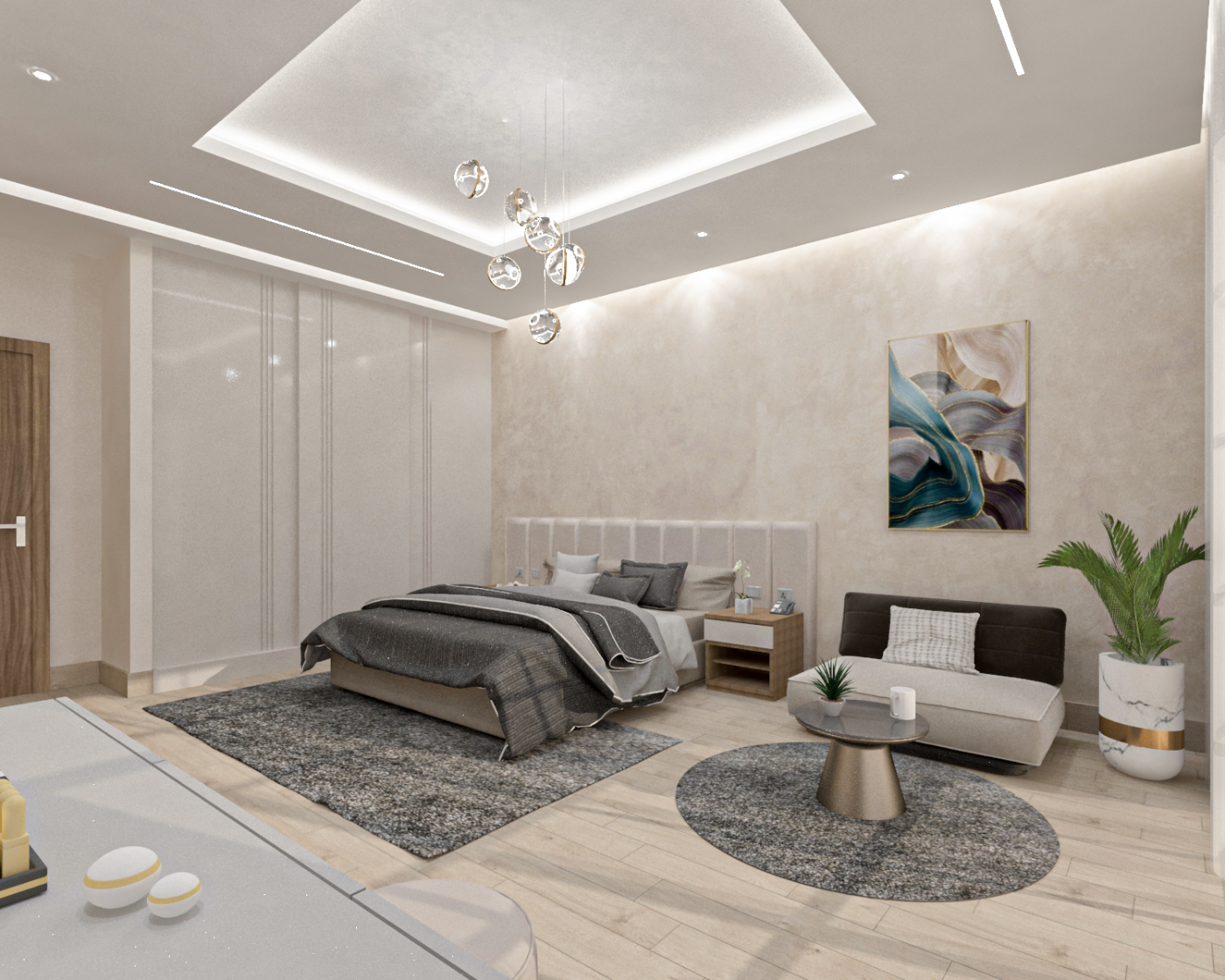 تصميم داخلي لغرفة النوم الرئيسية بسقف مجوّف وإضاءة معلّقة عنقودية وركن جلوس.